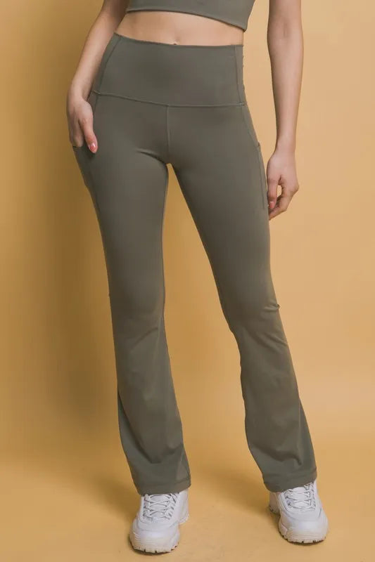 High waist flare leggings with side pockets front view in moss