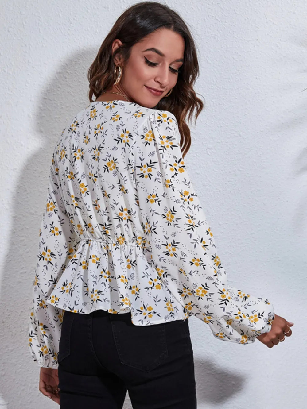 Floral blouse balloon sleeve detail on model
