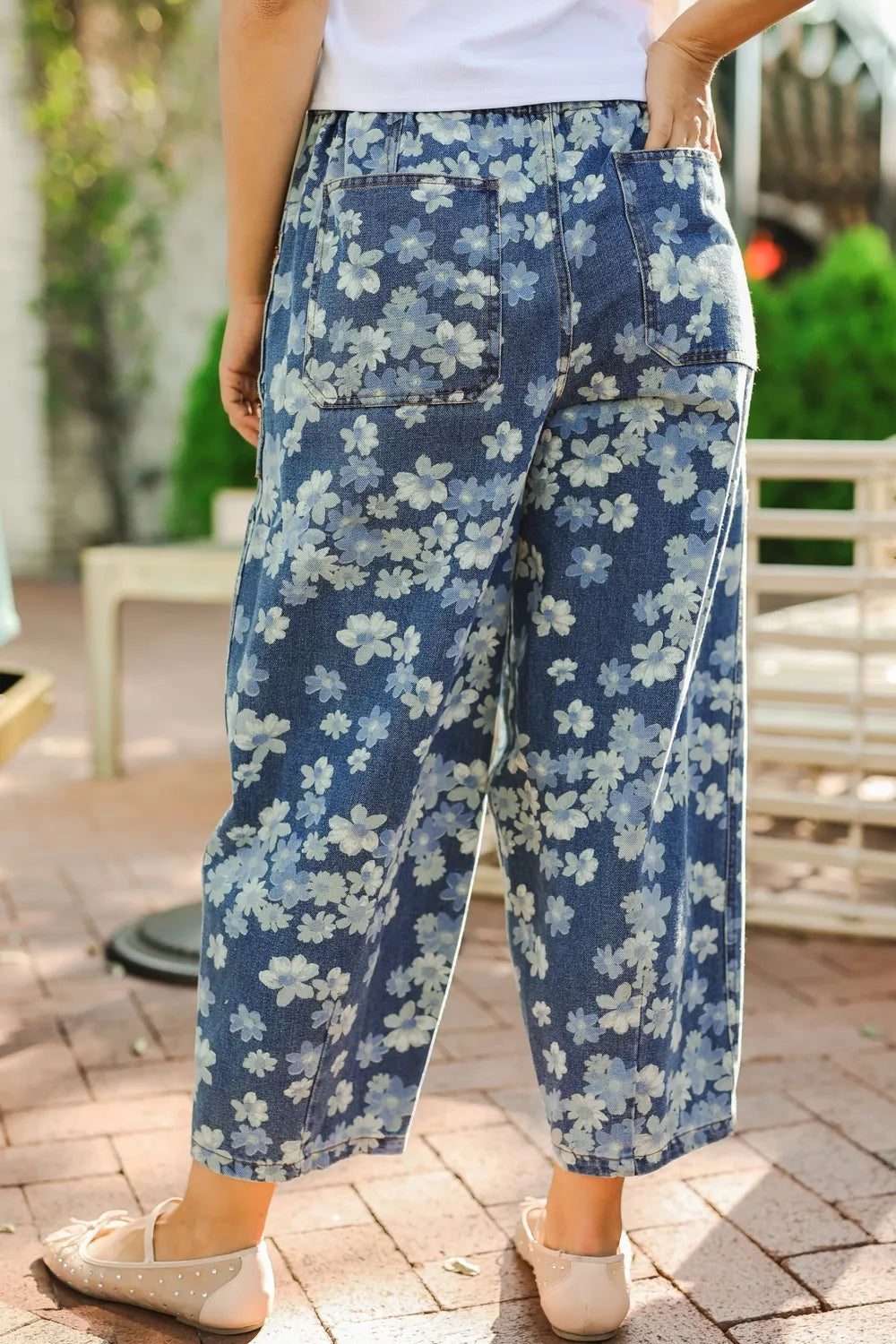 Woman wearing dainty floral barrel jeans