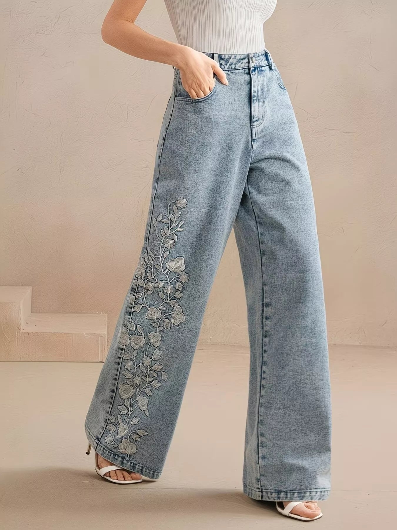 Embroidered blue jeans back view