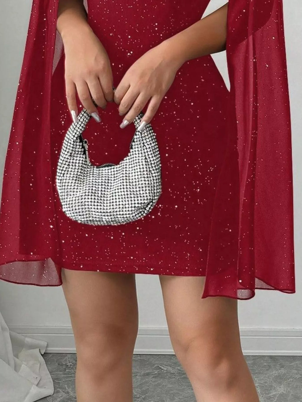 Cutout bodycon mini dress with cape sleeves styled on model