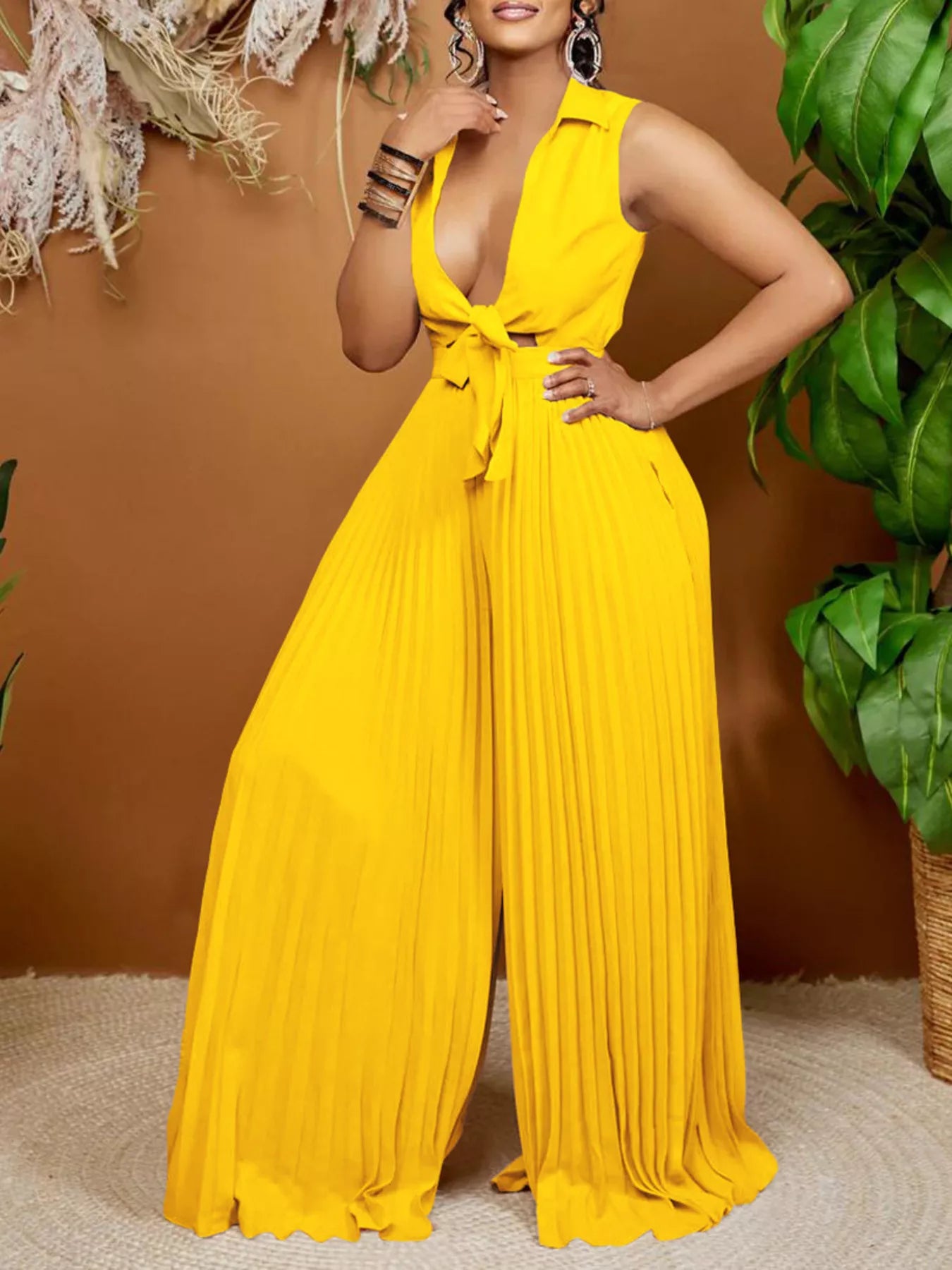 Wide leg jumpsuit side view showing pleated legs