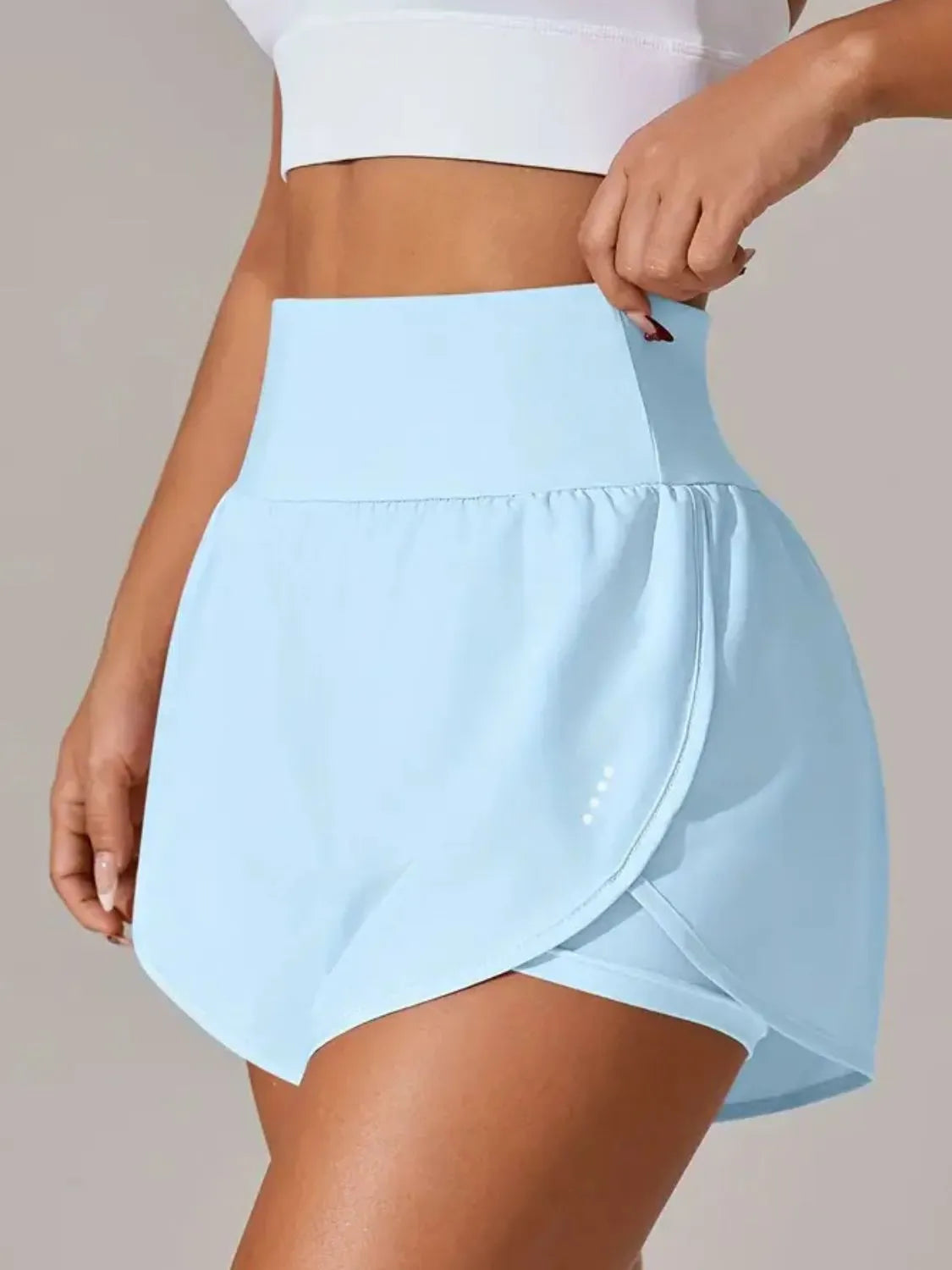 Light blue gym shorts back view on model