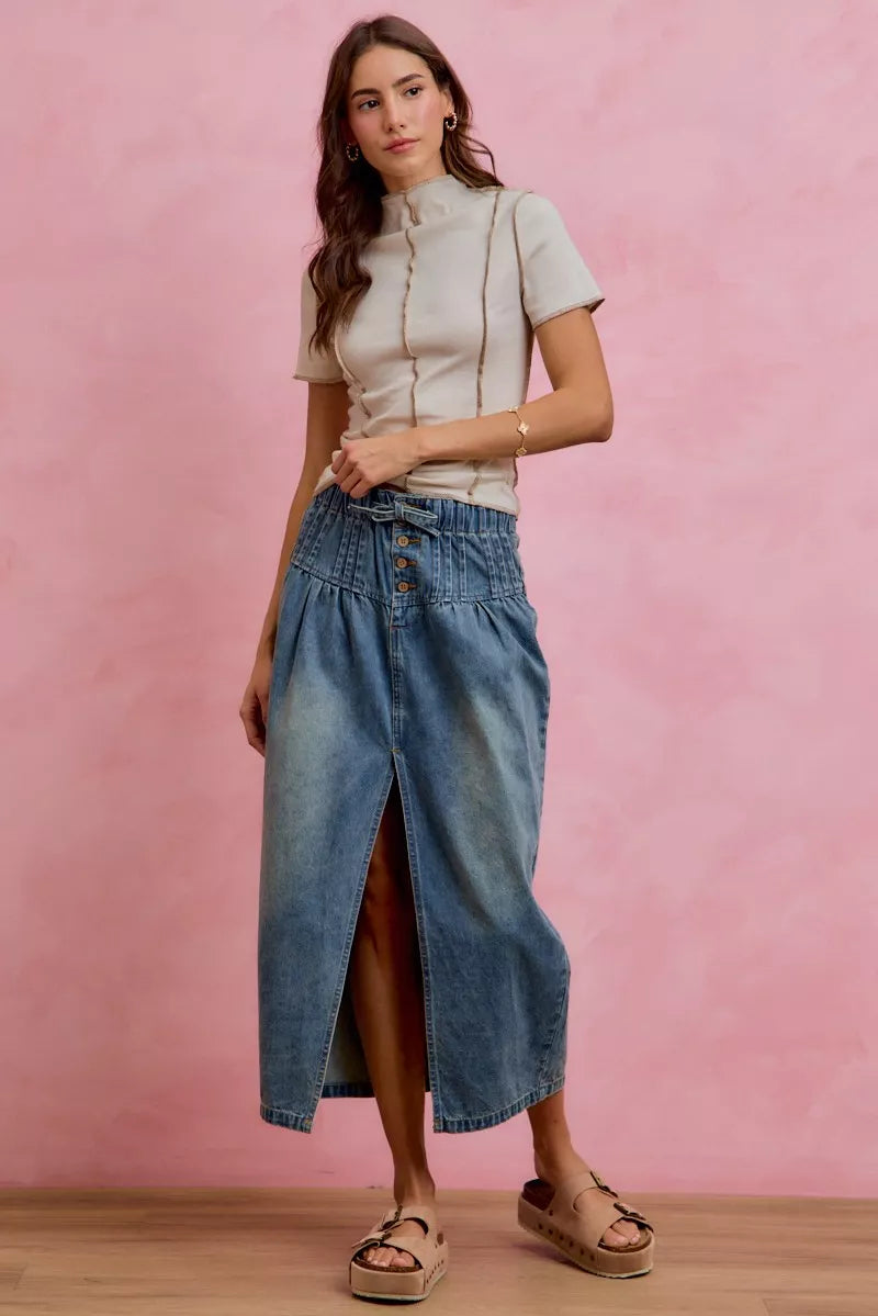 Pleated denim skirt waistband detail view