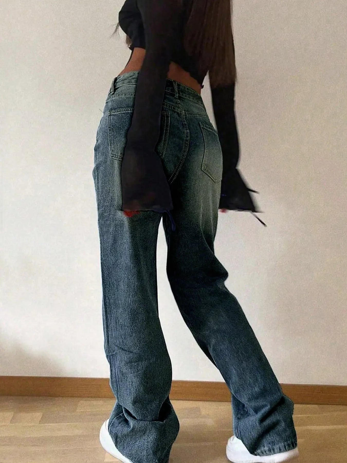 Blue vintage wash wide leg jeans styled full length view