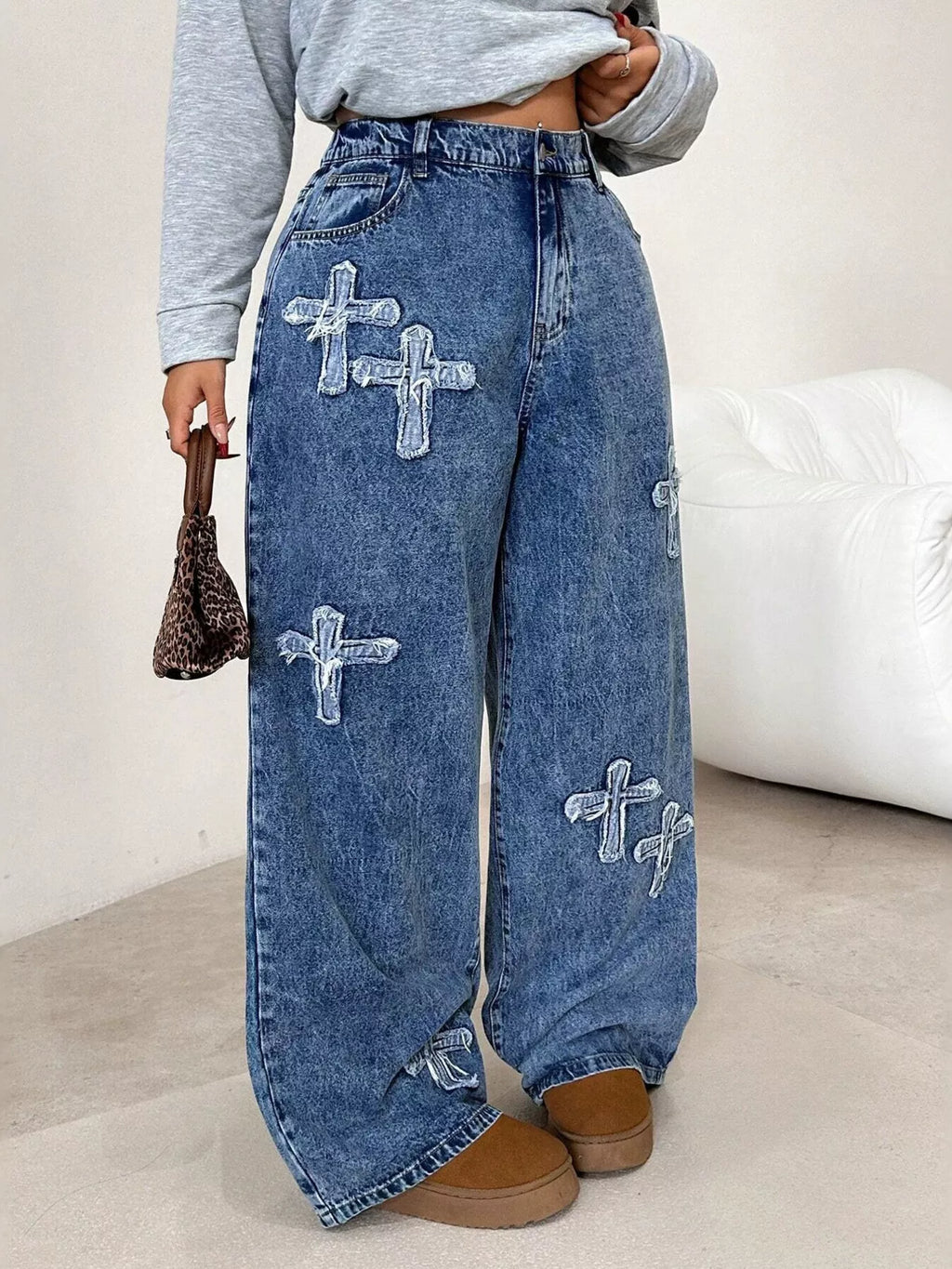 Embellished cross jeans back view with wide leg silhouette