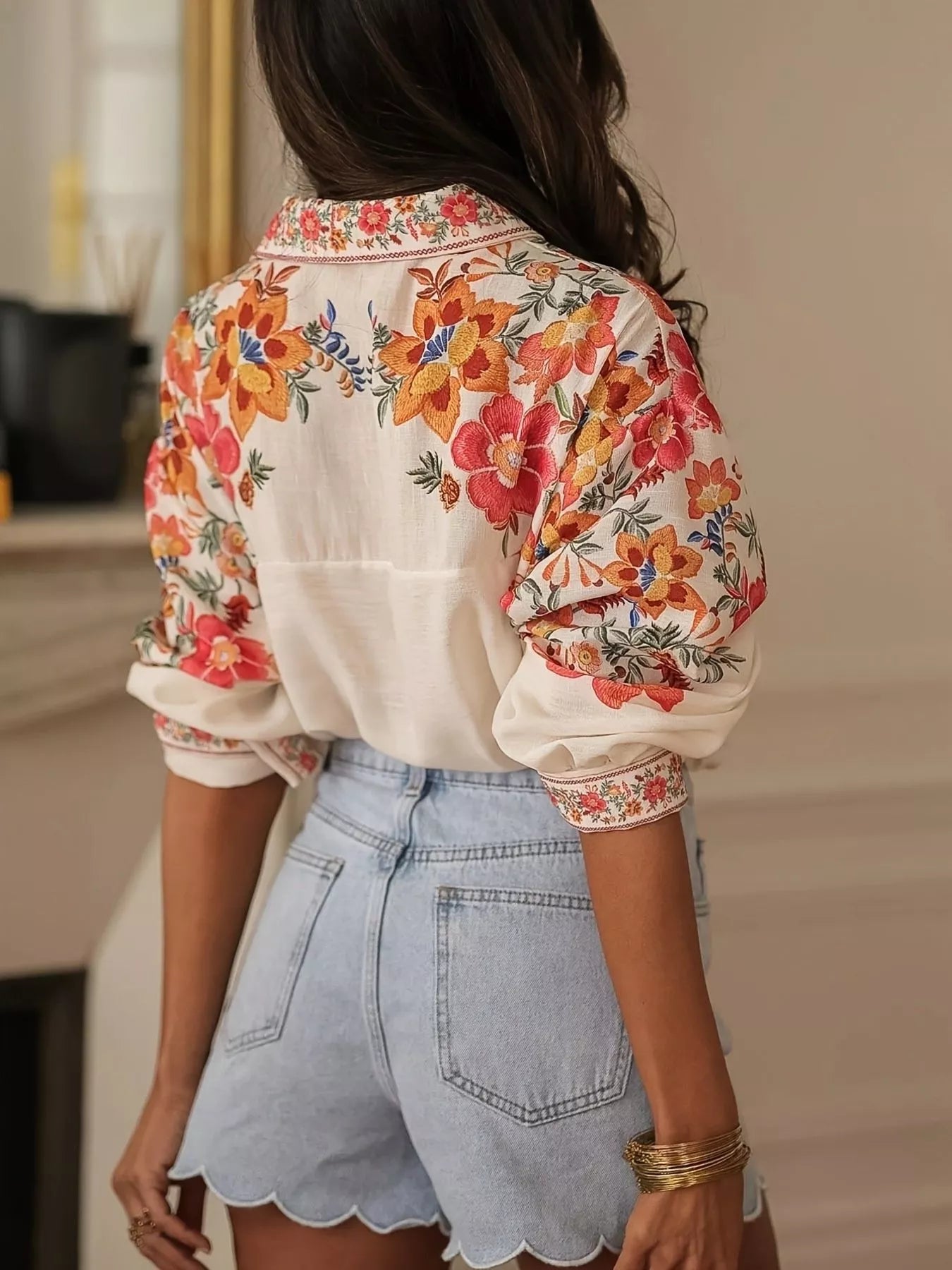 Model styling floral button up shirt in apricot