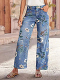 Light blue floral print wide leg jeans front view on model