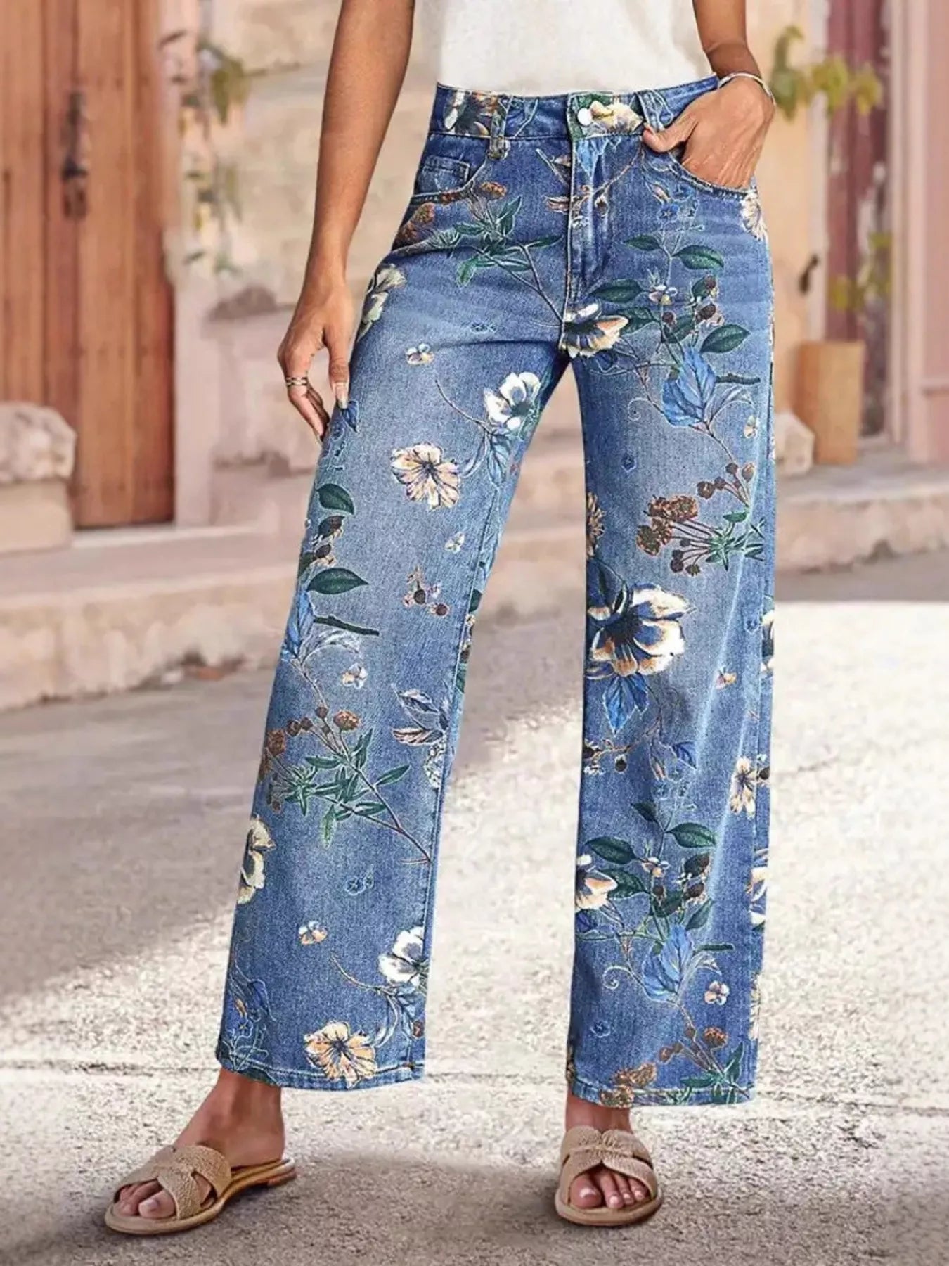 Light blue floral print wide leg jeans front view on model