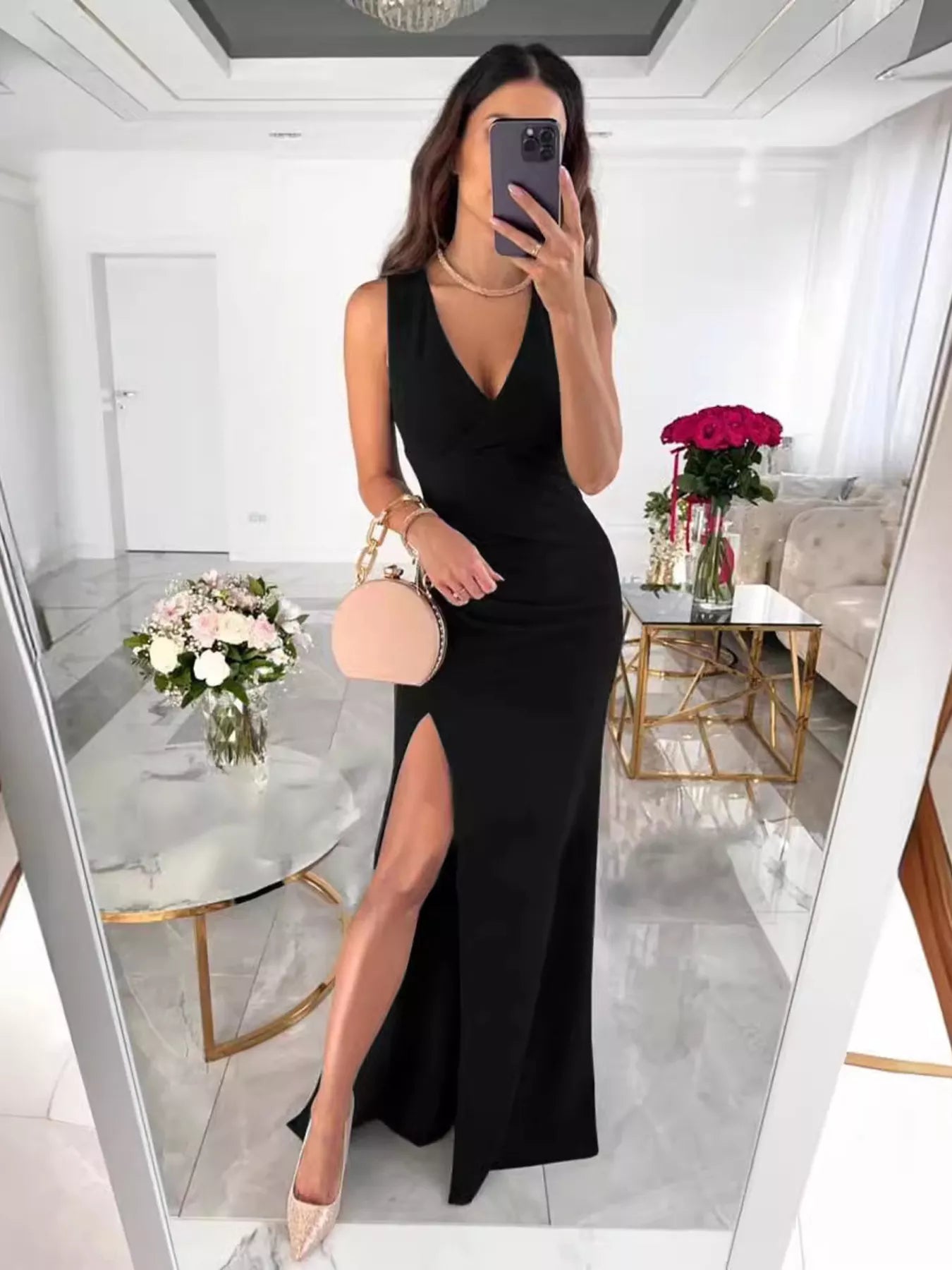 Sleeveless ruched maxi dress standing pose