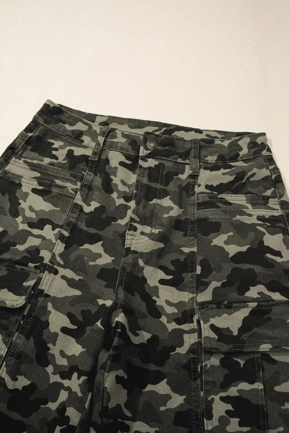 Model in green camo cargo pants walking view