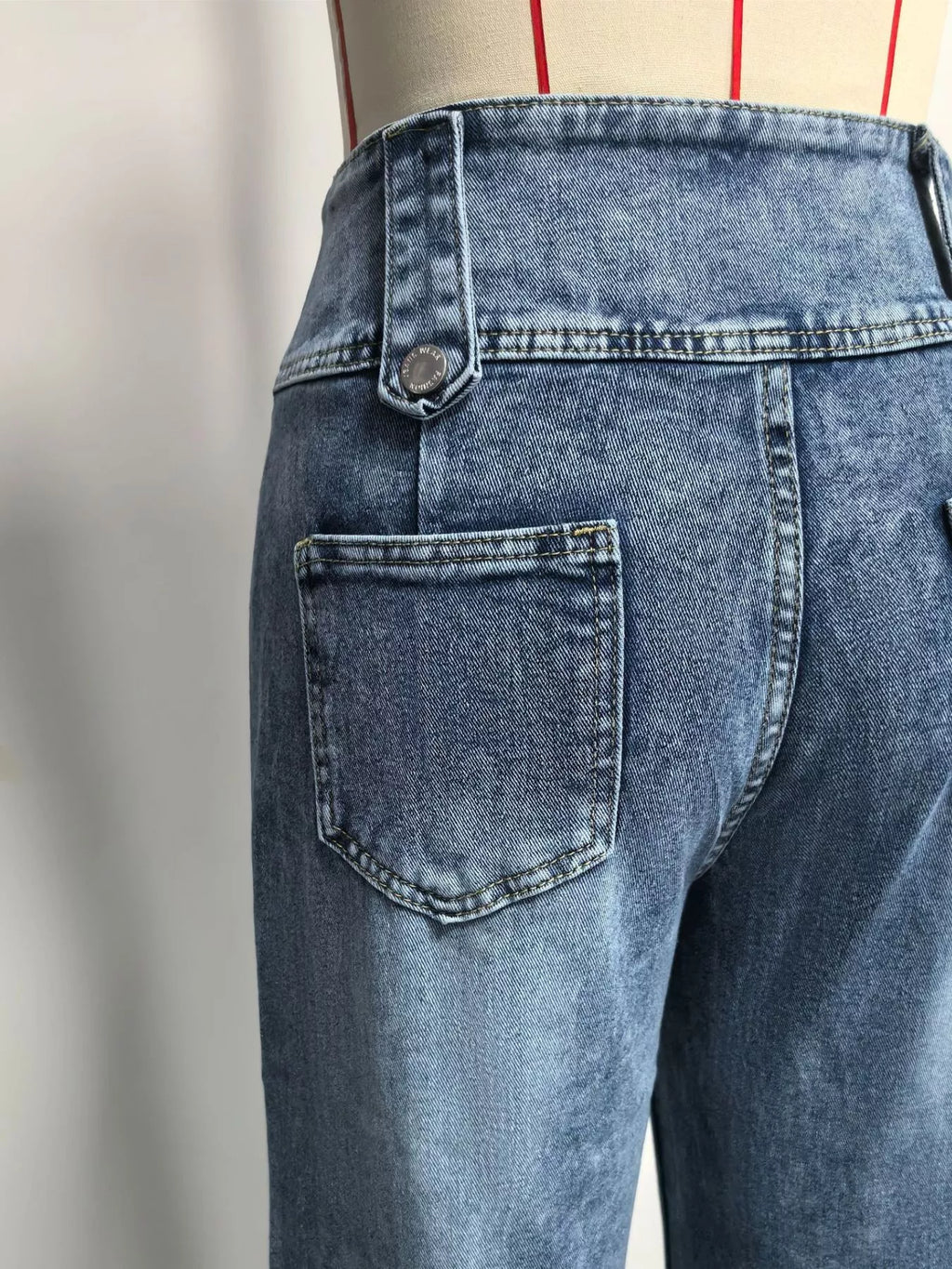 High waist button jeans styled outfit full length view