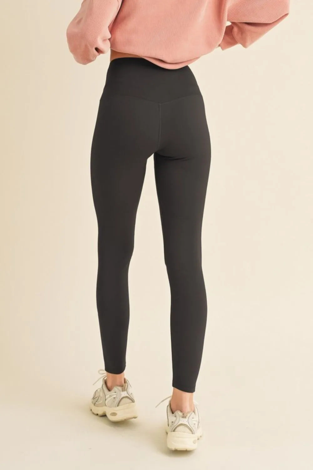 Fleece lined high waisted leggings back view in black