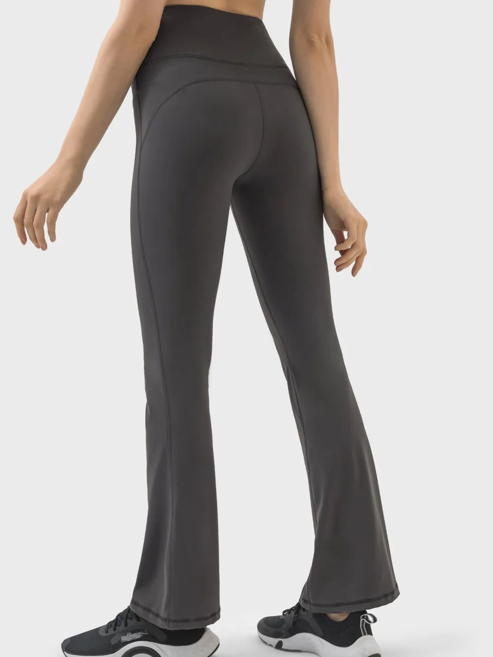 Woman wearing chocolate high waist active pants front view