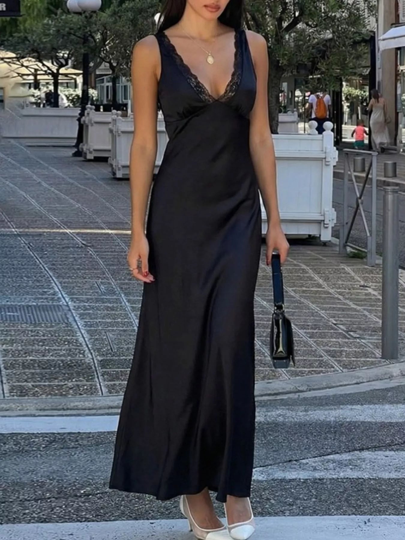 Sleeveless black maxi dress full length model shot