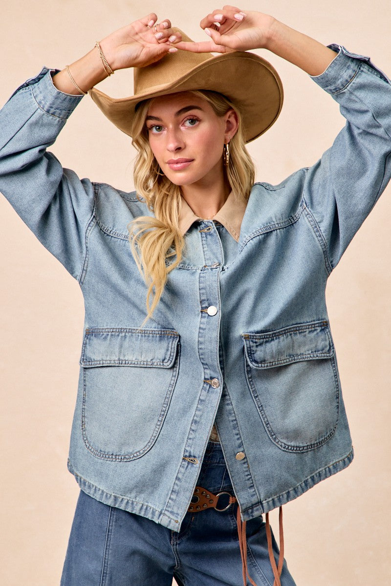Woman wearing vintage washed denim jacket with contrast collar