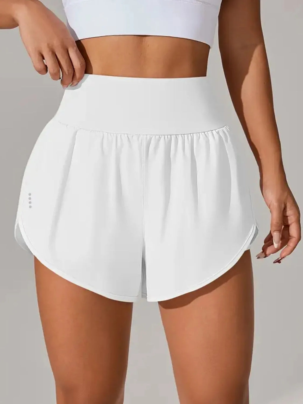 Blush pink workout shorts side view on model