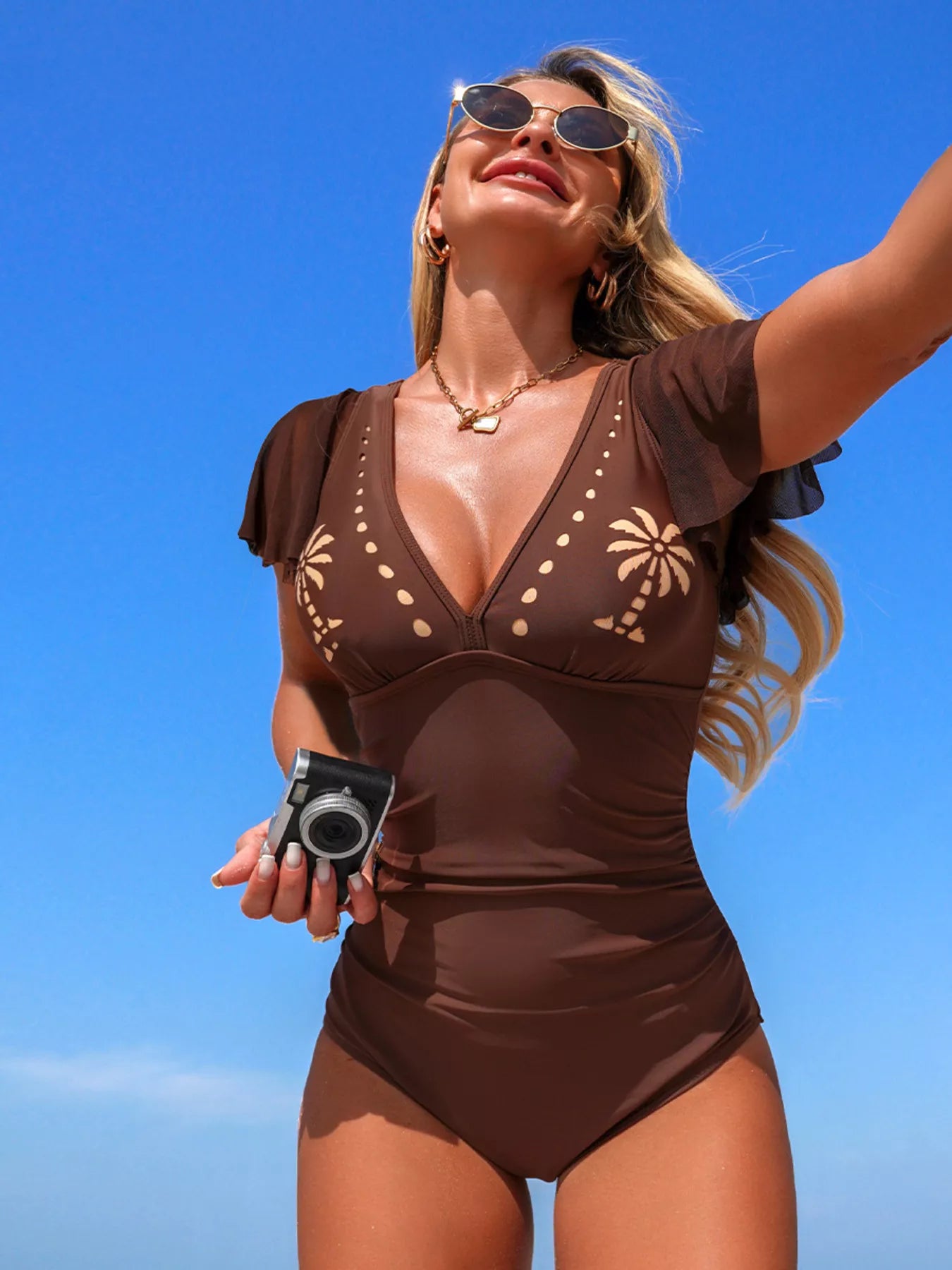 Orange one piece swimsuit side view on model