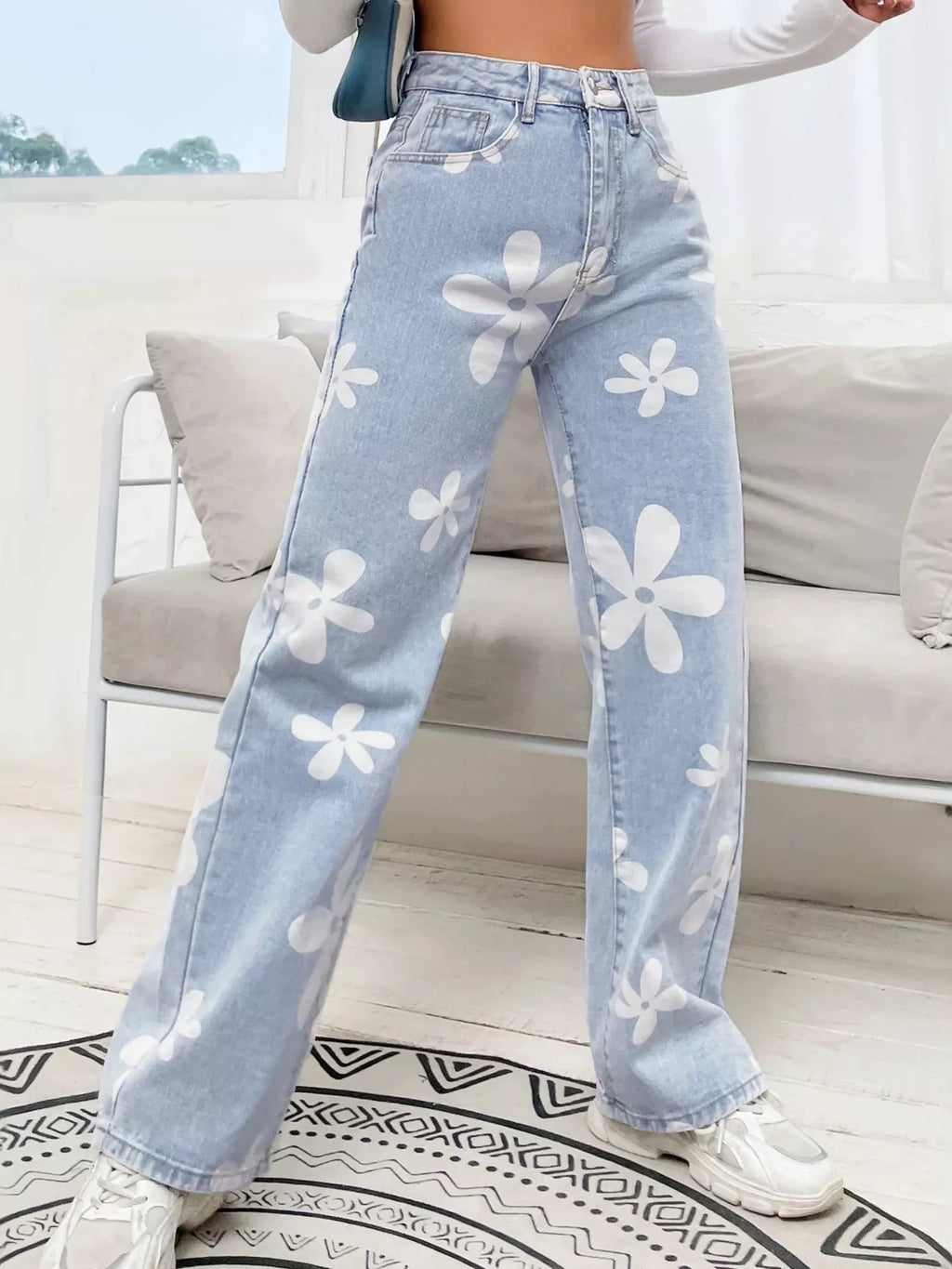 Black floral wide leg denim jeans front view on model