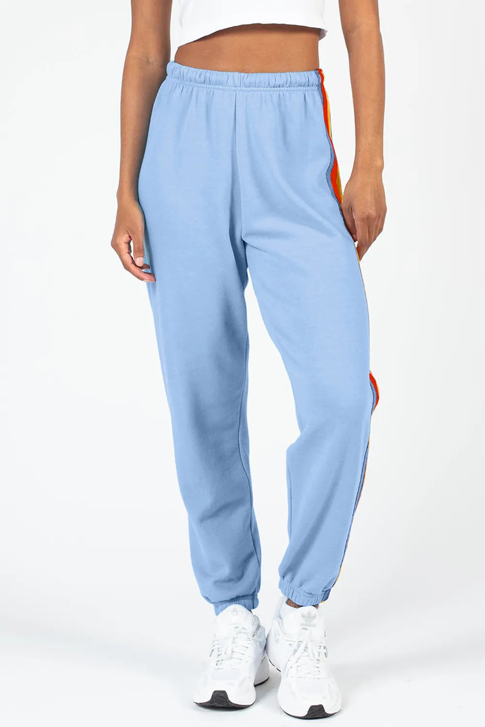 Model wearing contrast striped active pants