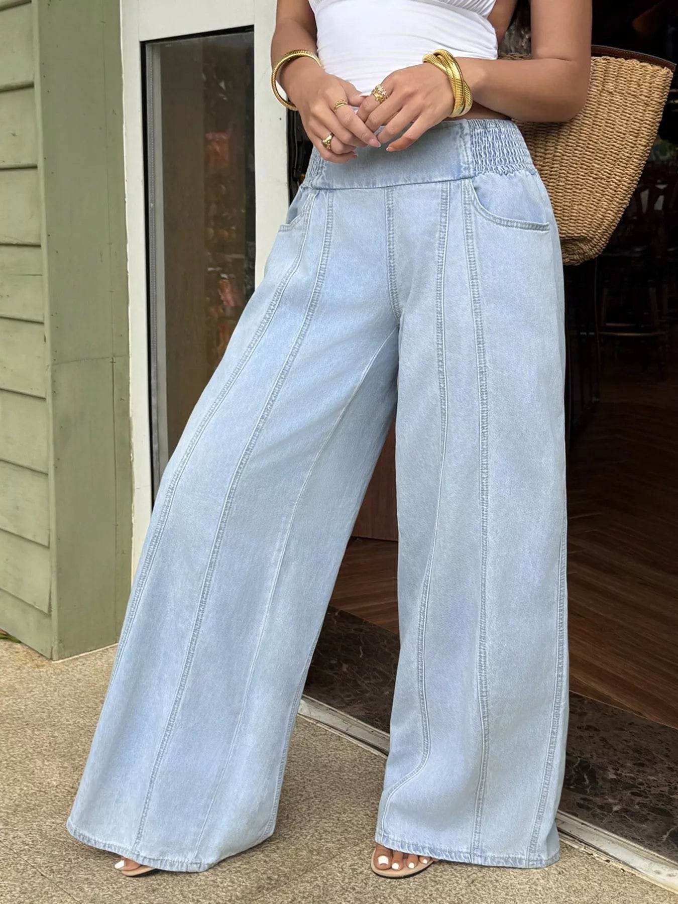 Full length view of washed wide leg denim jeans