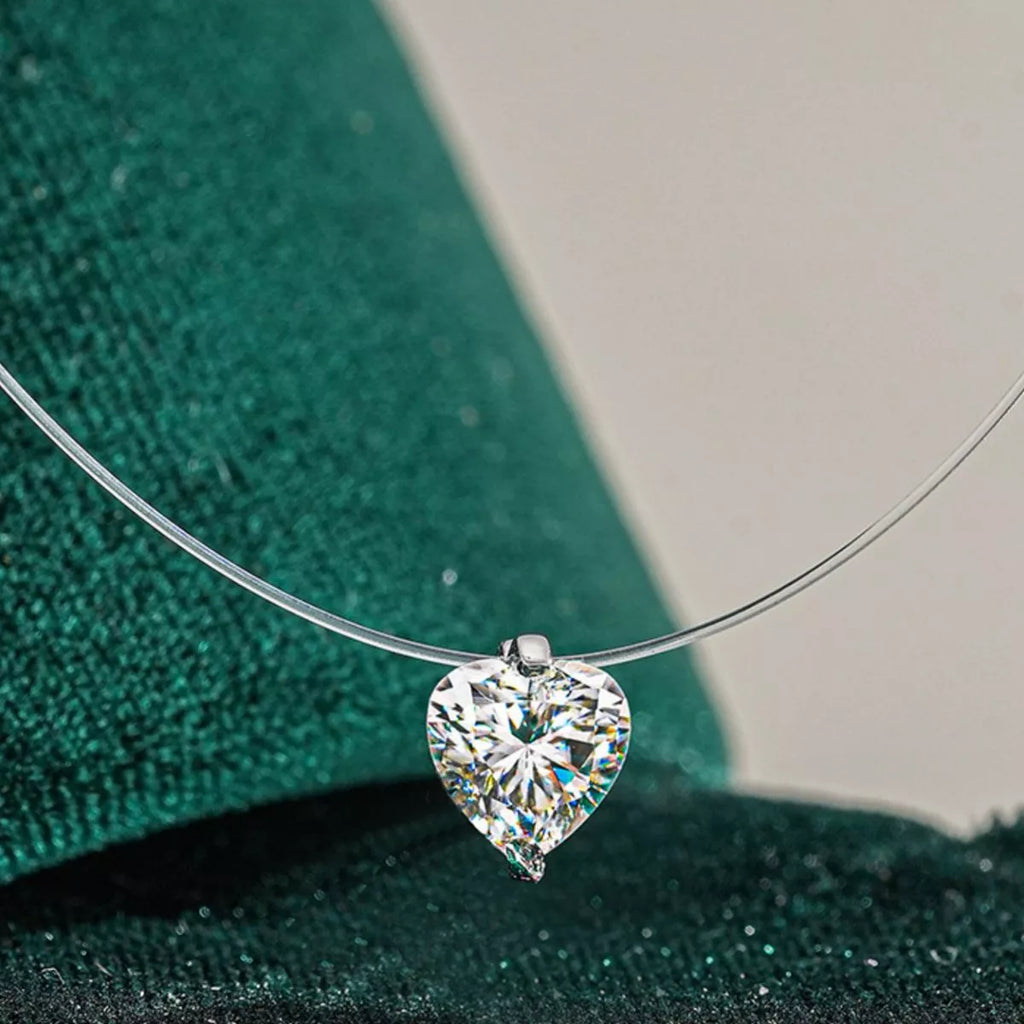 Heart pendant necklace shown on dainty chain