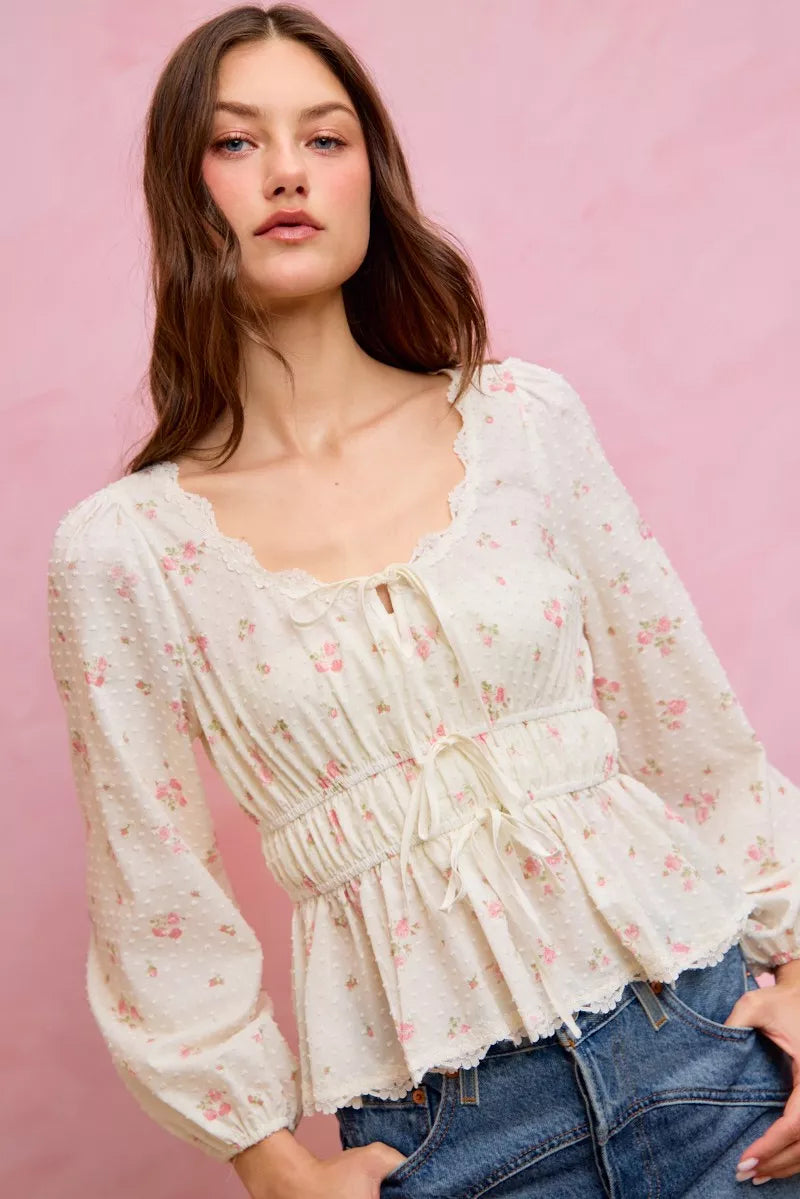 Floral blouse side profile showing ruched fit
