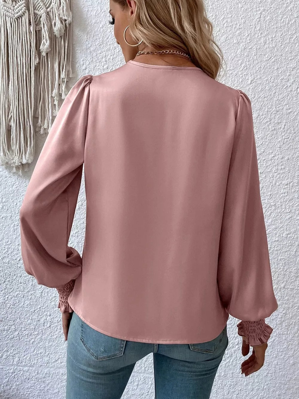 Surplice smocked blouse styled with trousers