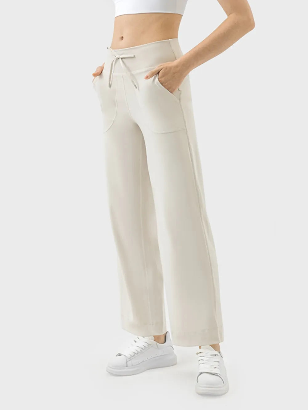 Mocha drawstring active pants styled with sneakers