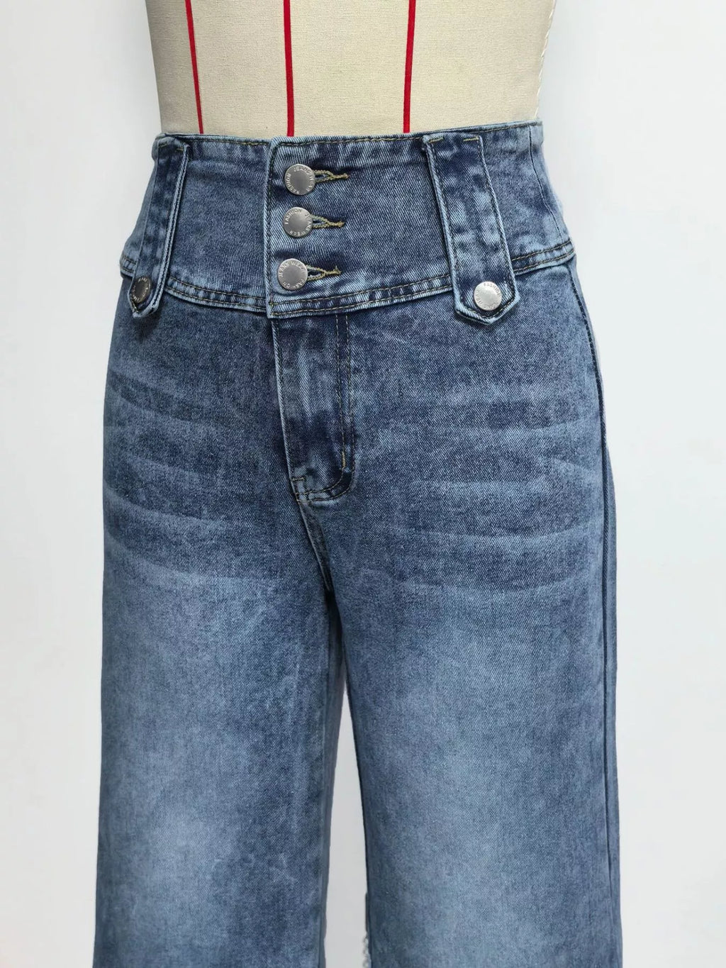 Side view of blue wide leg jeans with high rise waist