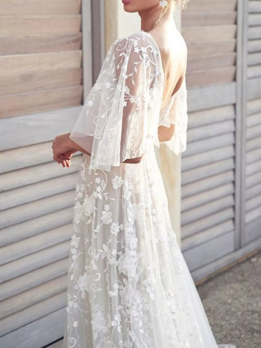 V neckline detail on white lace dress