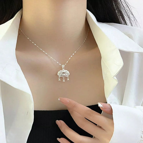 Silver lock pendant necklace close up detail