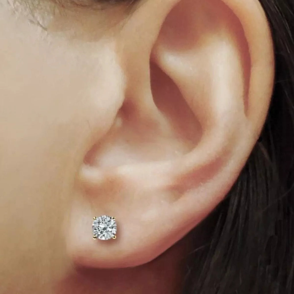 Moissanite stud earrings angled sparkle view