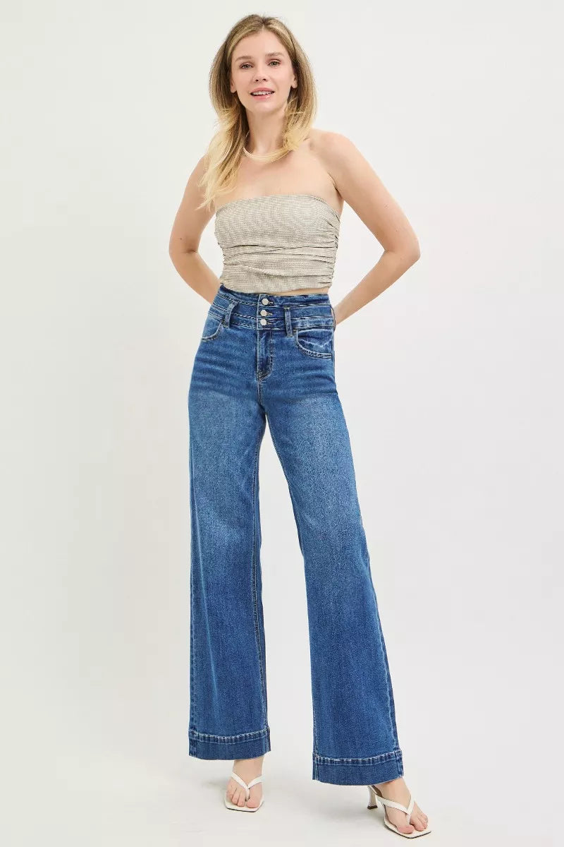 Button closure detail on RISEN wide band jeans