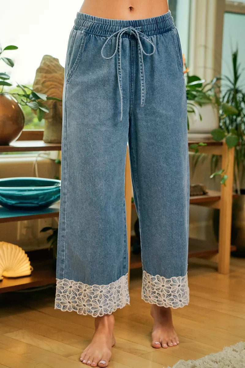 Floral lace waist trim detail on denim pants