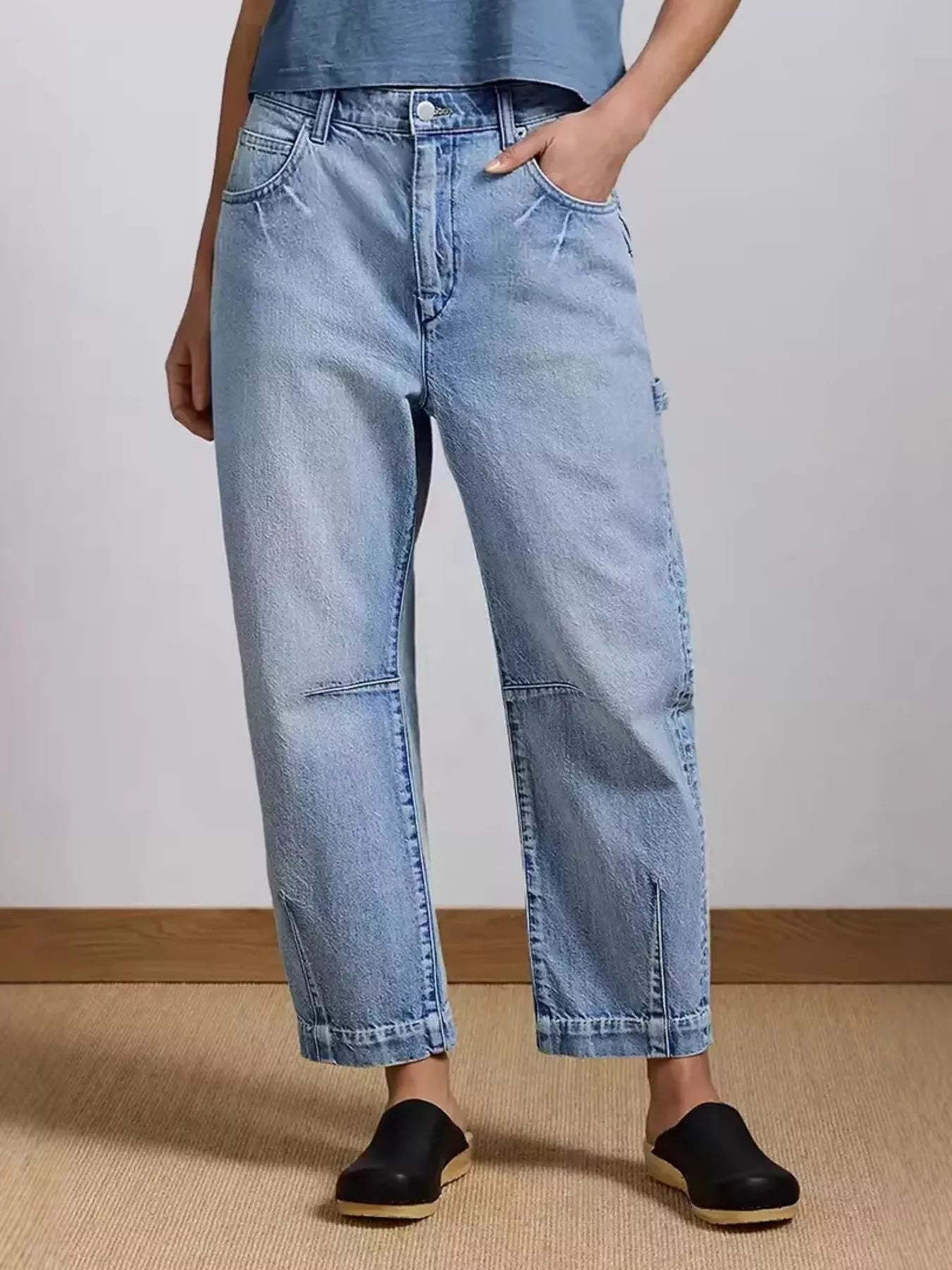 Washed blue wide leg stretch jeans front view on model