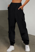 Black pocketed elastic waist jogger pants front view