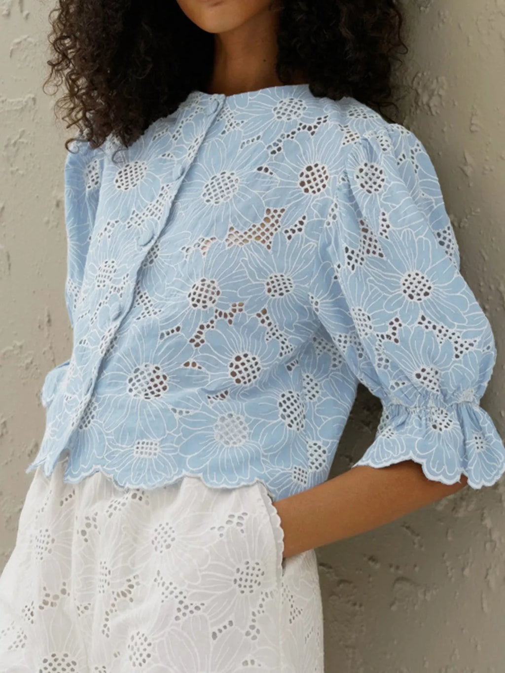 Light blue embroidered blouse side view