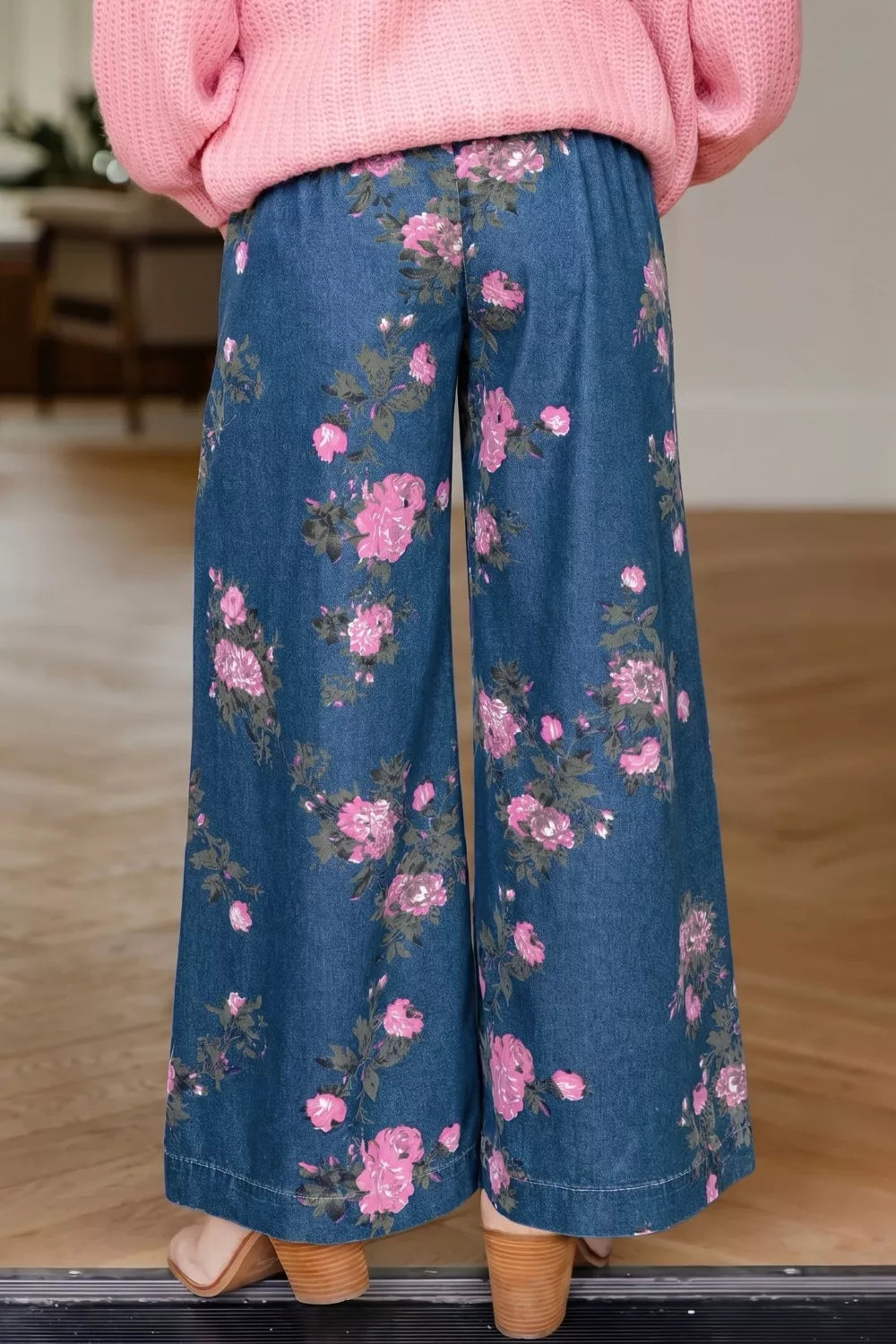 Floral print detail on medium wash denim