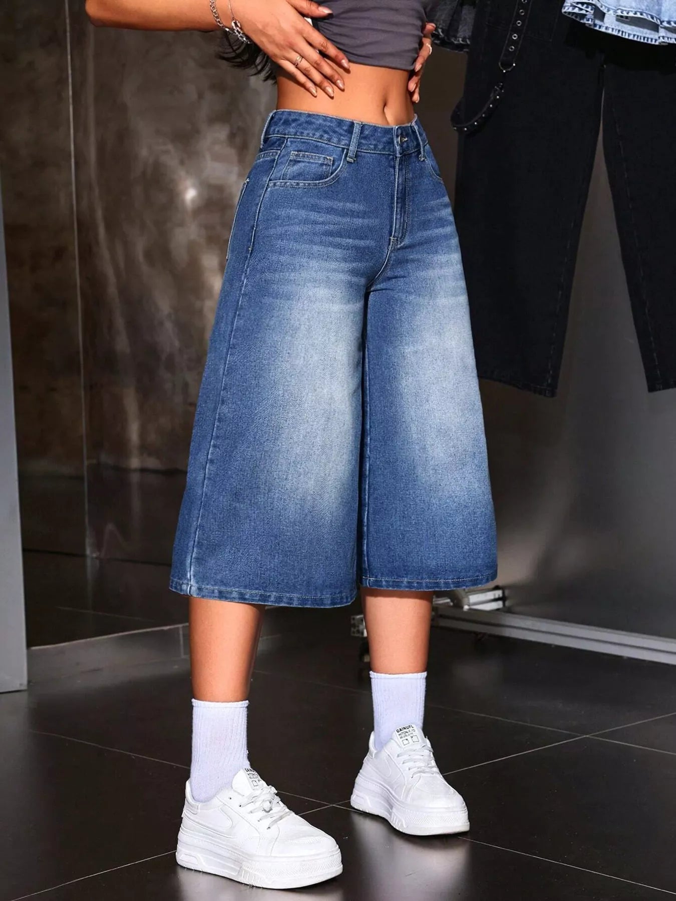Blue denim capris side view with cropped wide leg silhouette