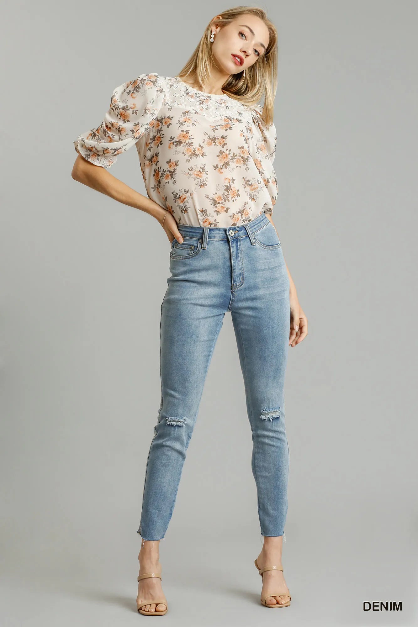 Distressed stretch denim skinny jeans front view