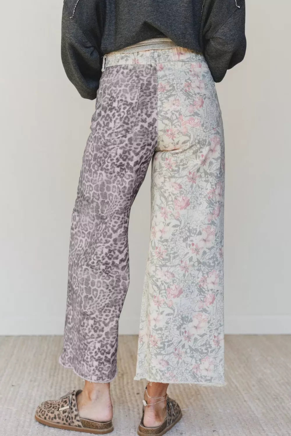 Woman wearing leopard and floral print jeans
