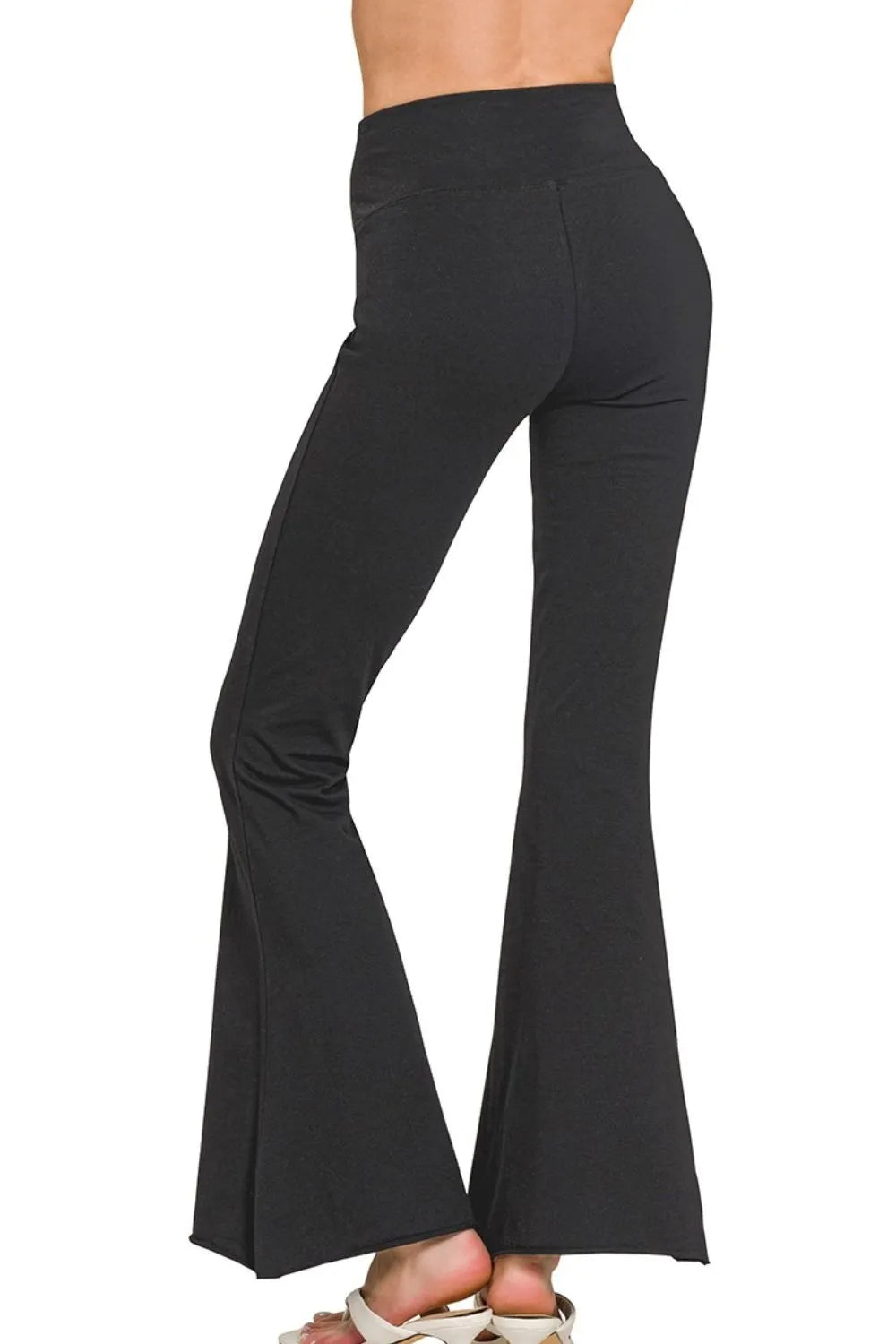 Model styled in black high waisted flare yoga pants
