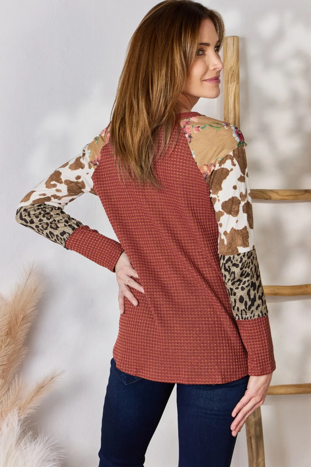 Leopard print waffle knit top on model