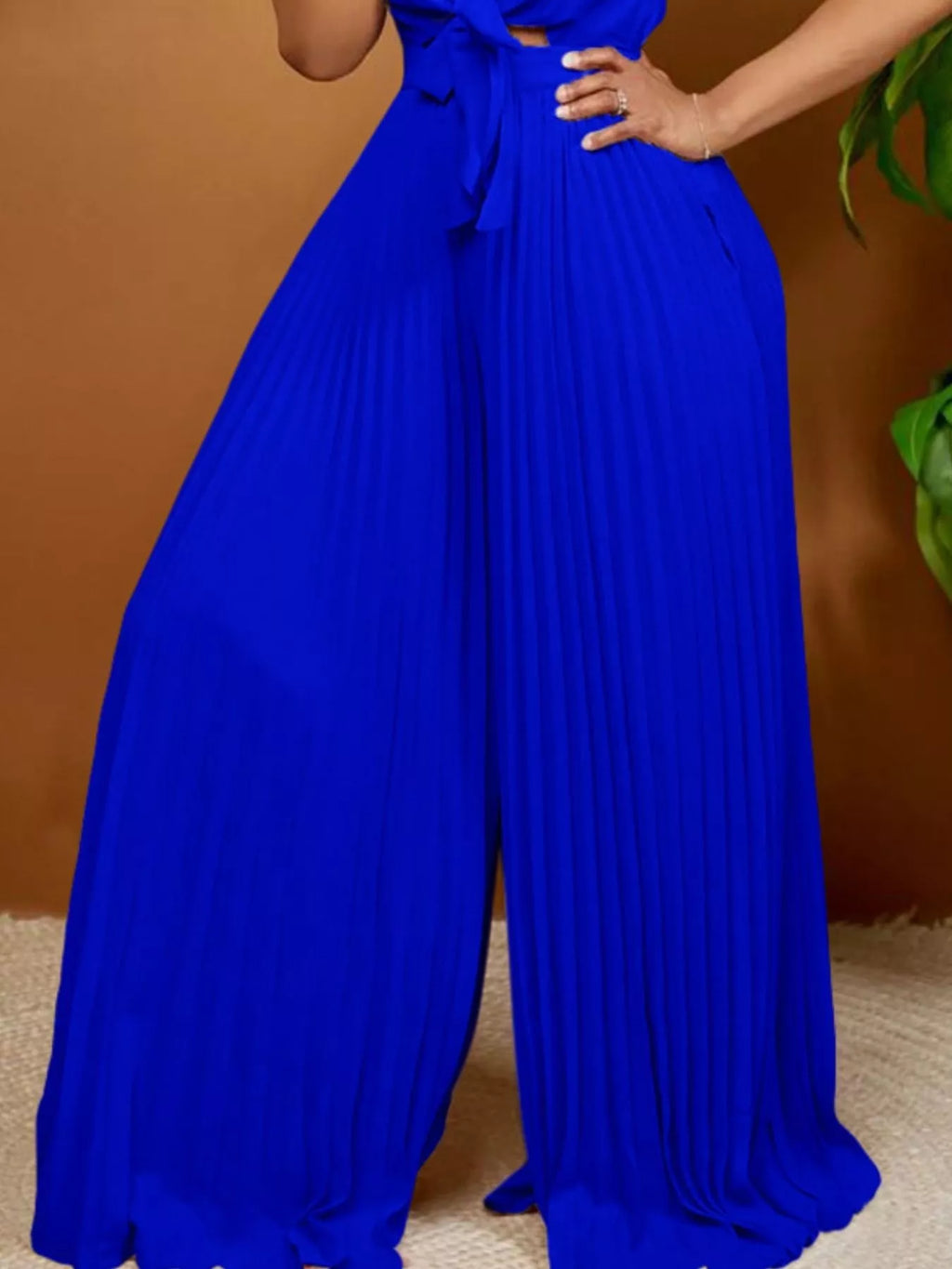 Blue wide leg jumpsuit on model full length