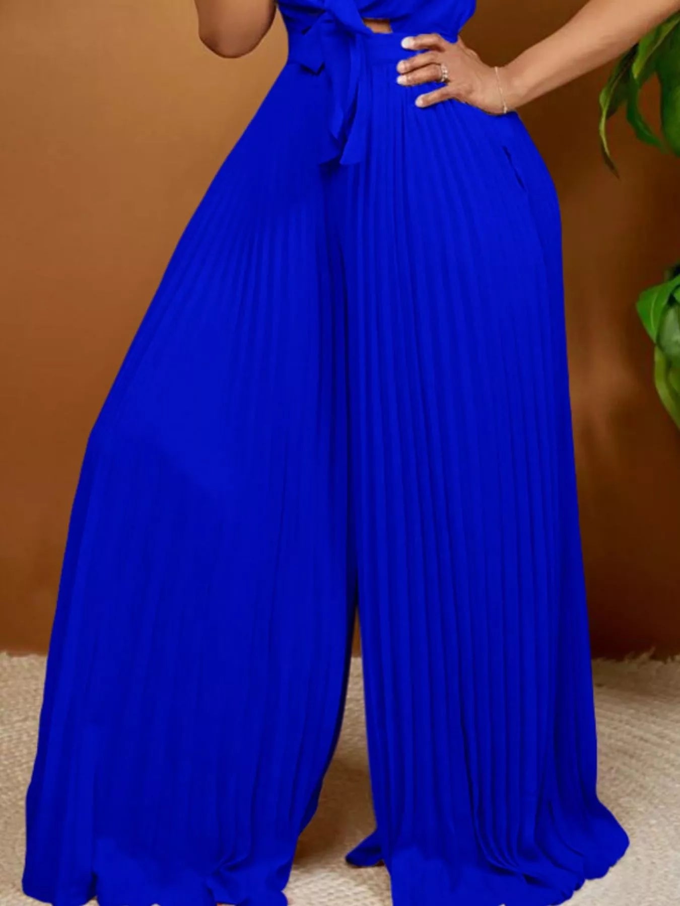 Blue wide leg jumpsuit on model full length