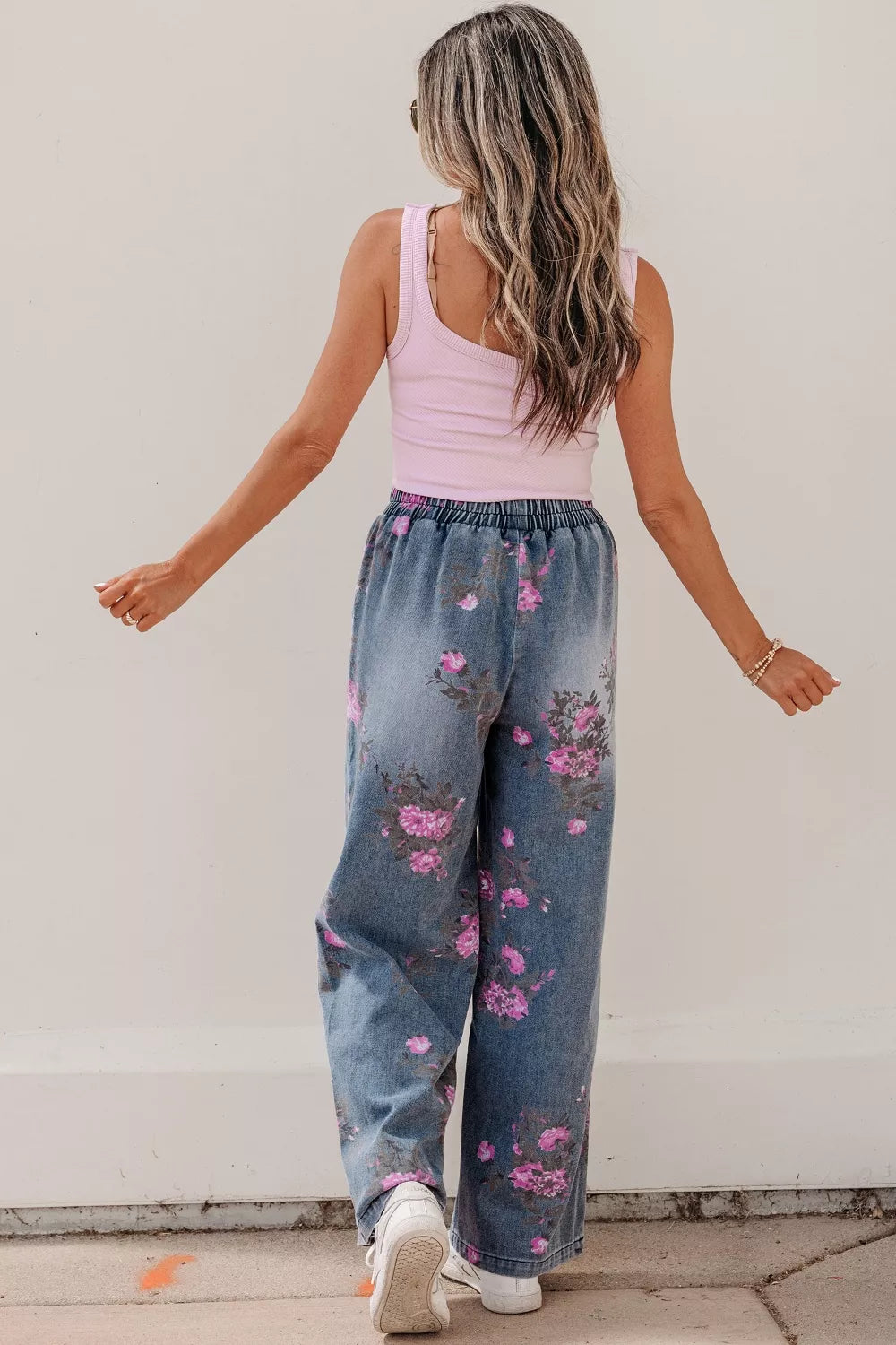 Floral print wide leg jeans styled full length view