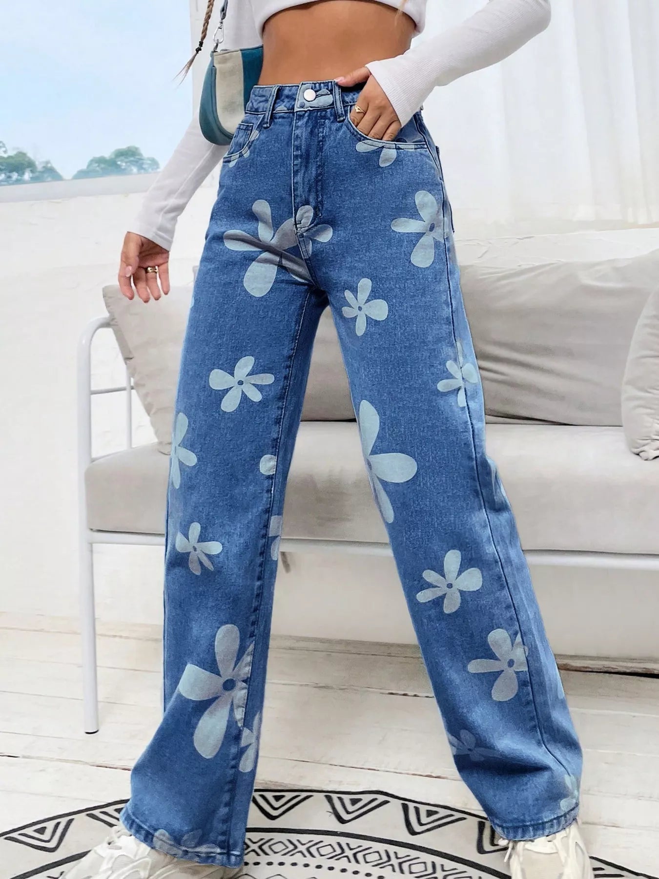 Light blue floral wide leg jeans back view showing pockets