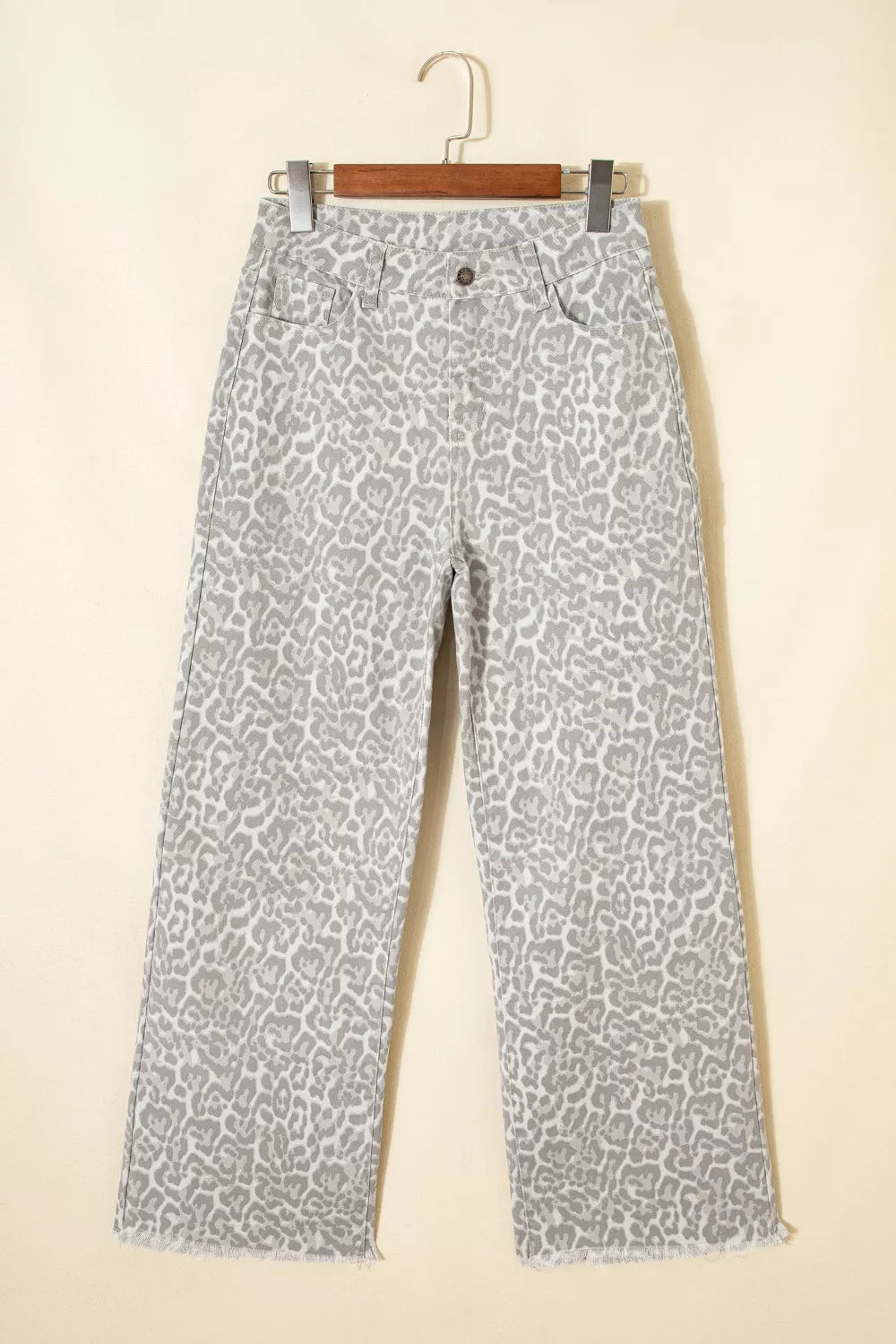Raw hem detail on white leopard print jeans