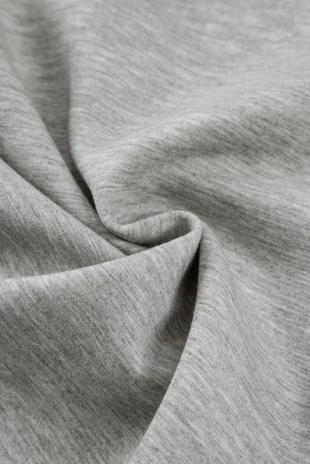 Model wearing gray drawstring active pants styled casually